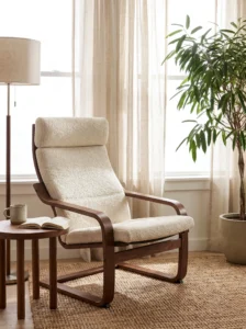 IKEA POÄNG armchair makeover with a dark walnut bentwood frame and a cream bouclé cushion cover.