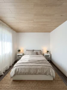Light oak-look peel-and-stick ceiling planks in a simple, budget-friendly rental bedroom.