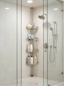 Stainless-steel tension-pole shower caddy in a tiled corner with organized shampoo, conditioner, and body wash bottles.