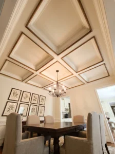 Budget-friendly coffered ceiling made from a symmetrical grid of slim wood boards in a dining room.