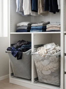IKEA PAX built-in laundry baskets with separate pull-out compartments for lights, darks, and everyday laundry.